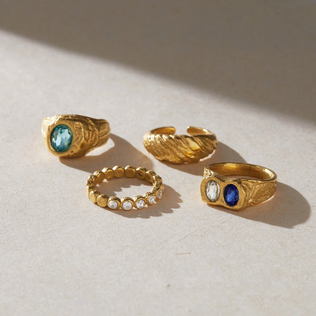 Gold chunky ring with blue crystal by Kat&Co.