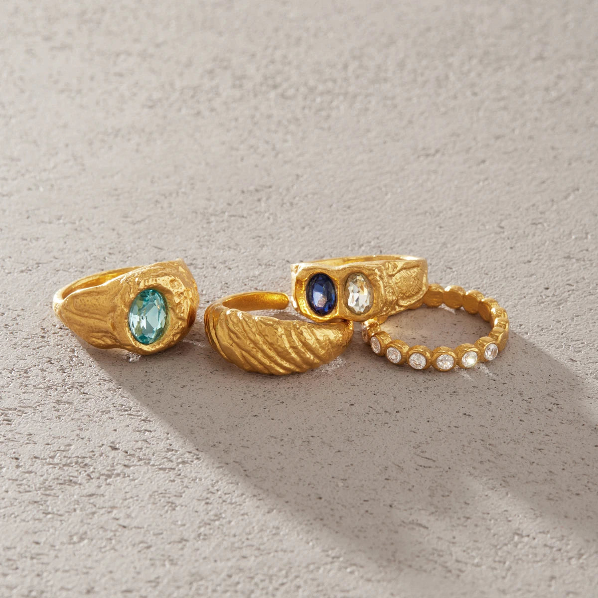 Gold chunky ring with blue crystal by Kat&Co.